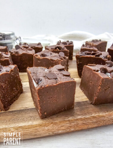 Pieces of chocolate fudge on wooden cutting board