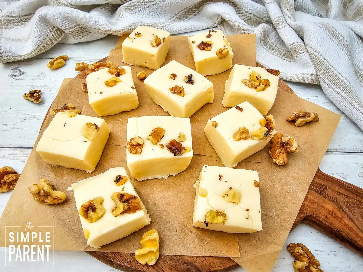 Pieces of maple walnut fudge on parchment paper