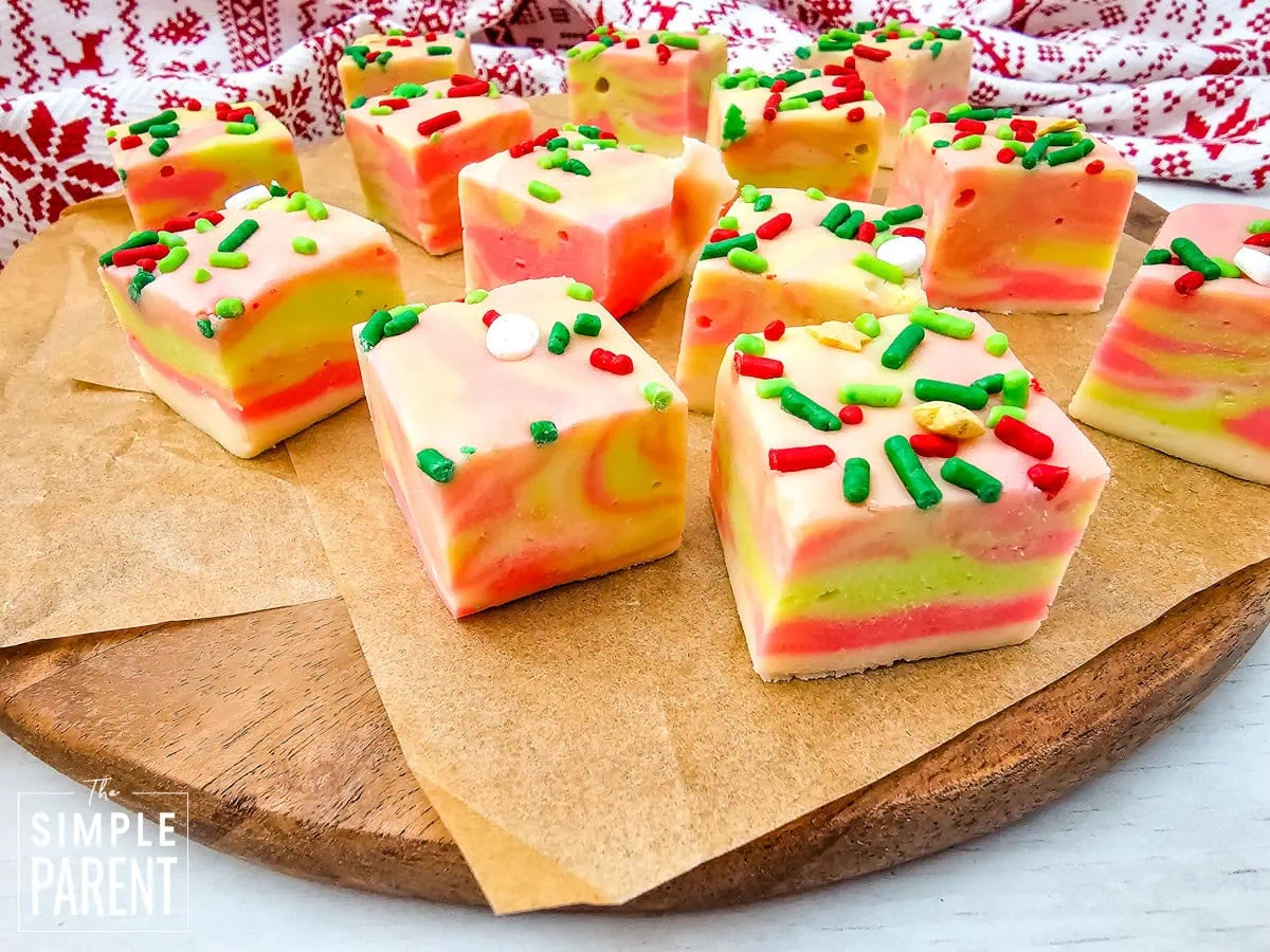 Pieces of white chocolate fudge for Christmas on brown parchment paper