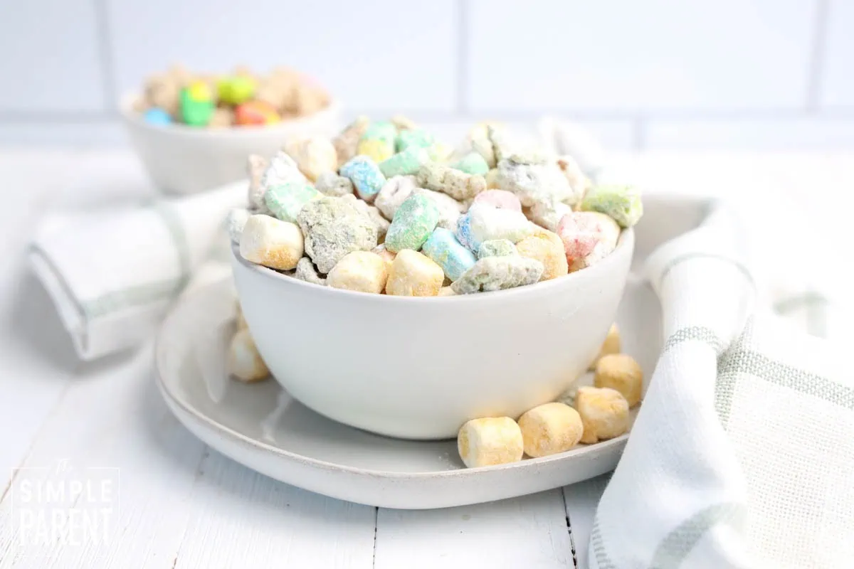Lucky Charms Snack Mix Recipe for St. Patrick's Day in a white bowl with gold marshmallows