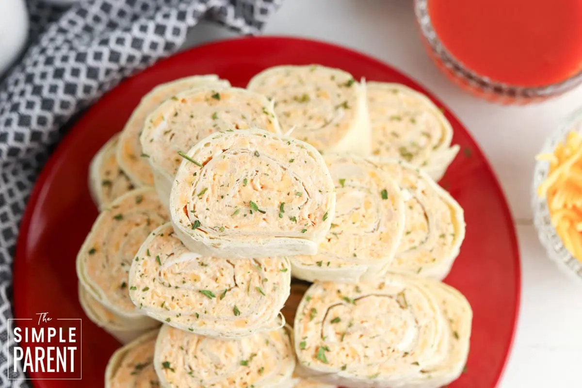 Buffalo Chicken Roll Ups on red plate