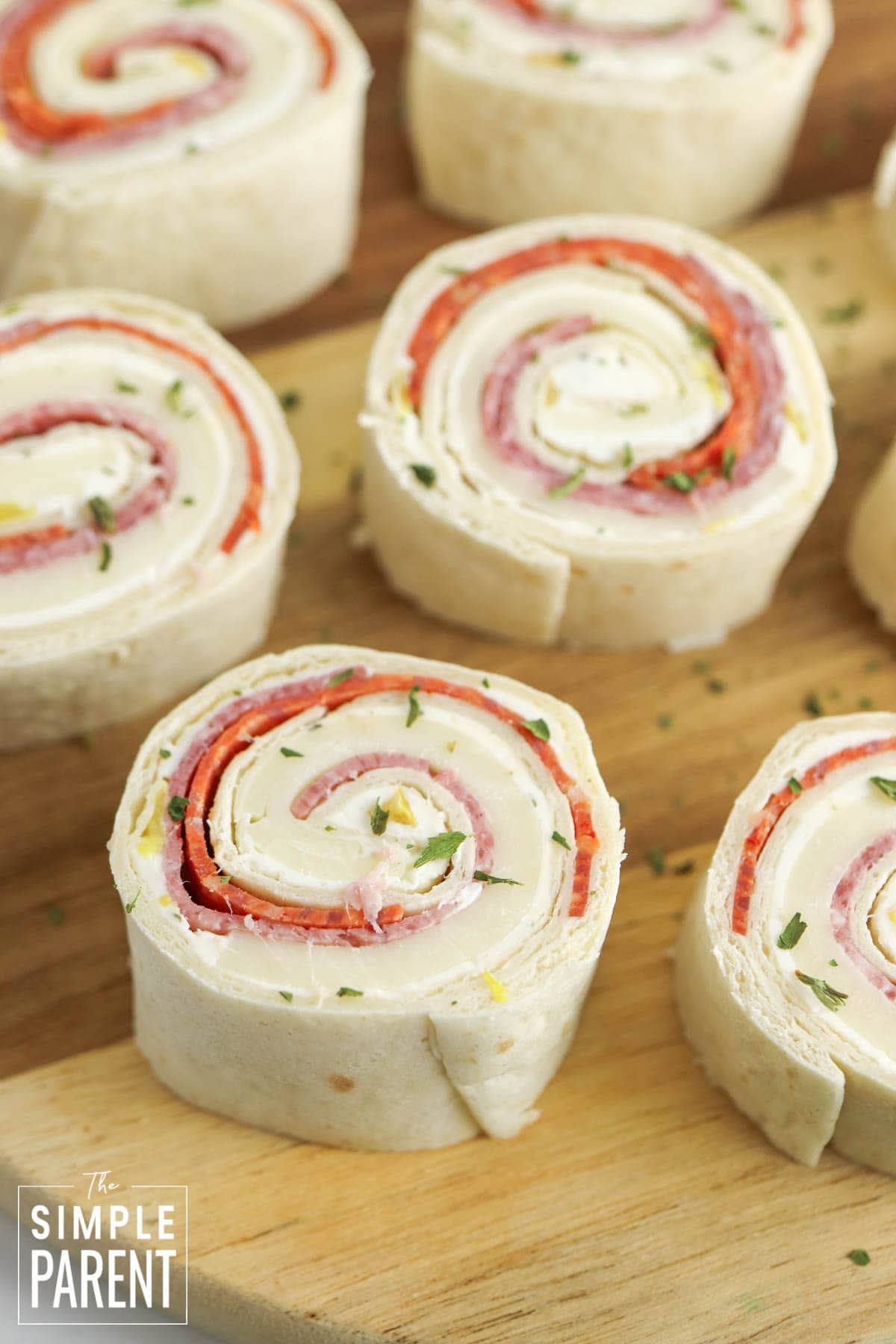 Italian Pinwheels on wooden serving plate