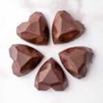 Heart shaped Nutella fudge bites on white counter