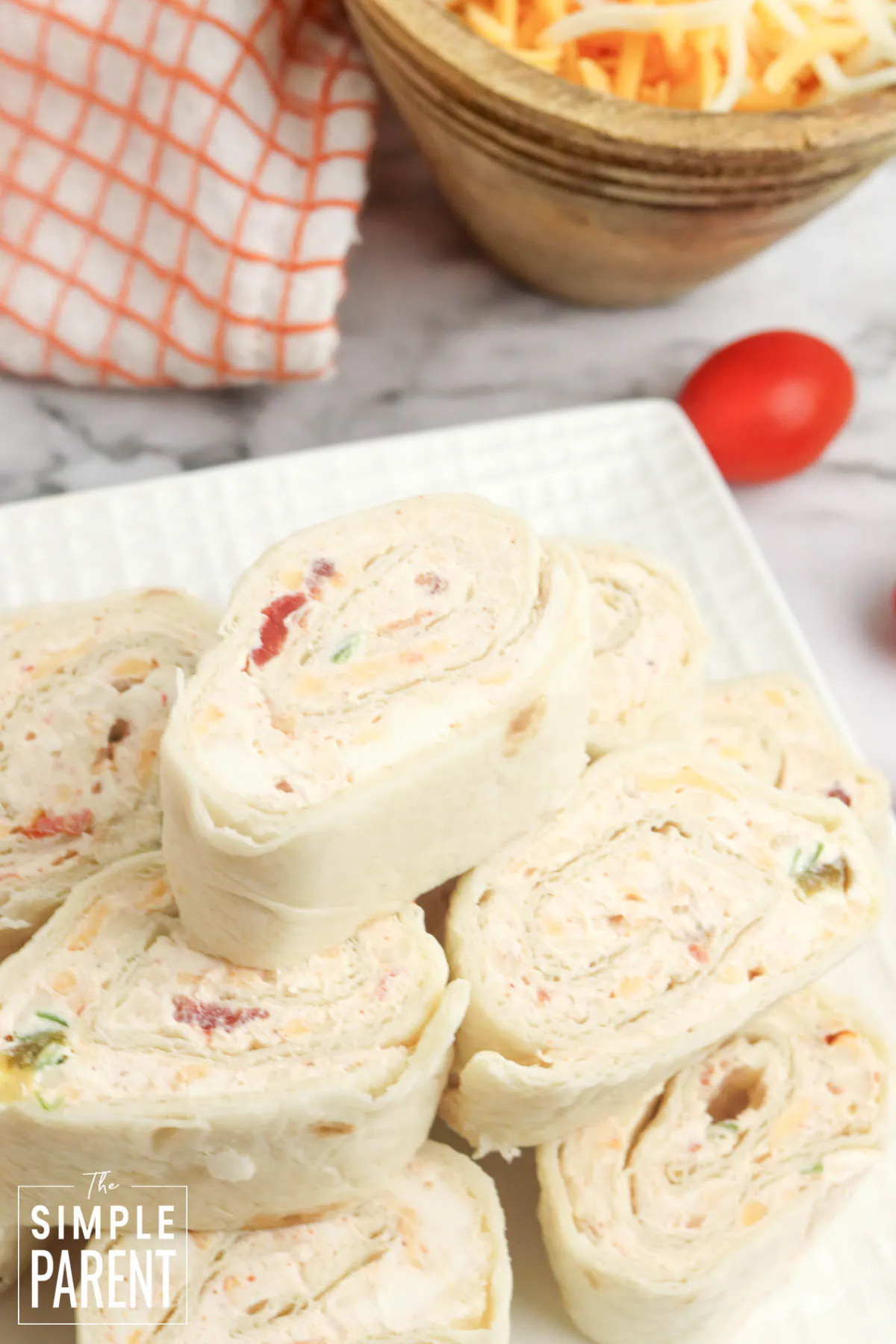 Taco Pinwheels stacked on white plate