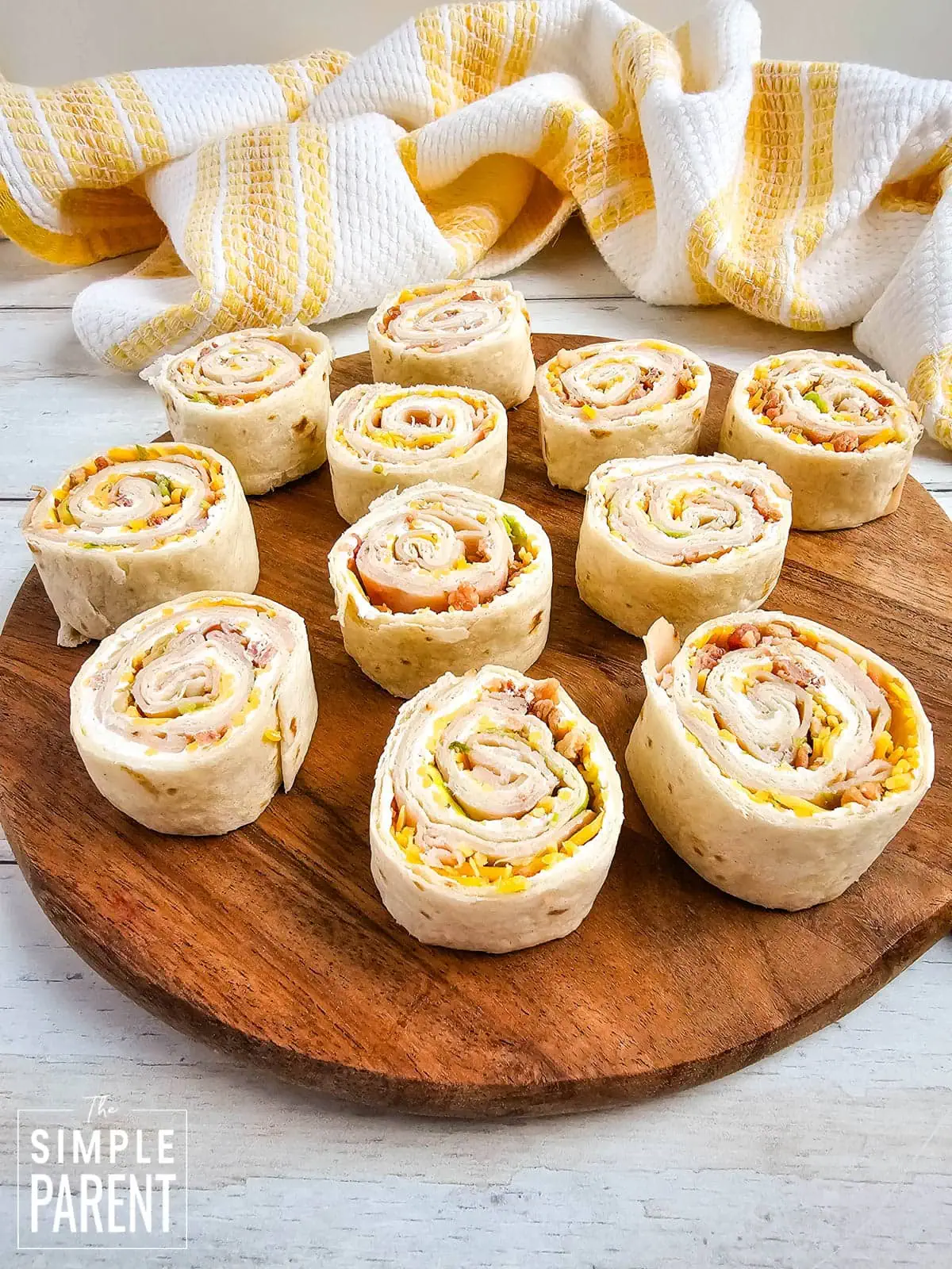 Turkey Club Pinwheels on wooden serving board