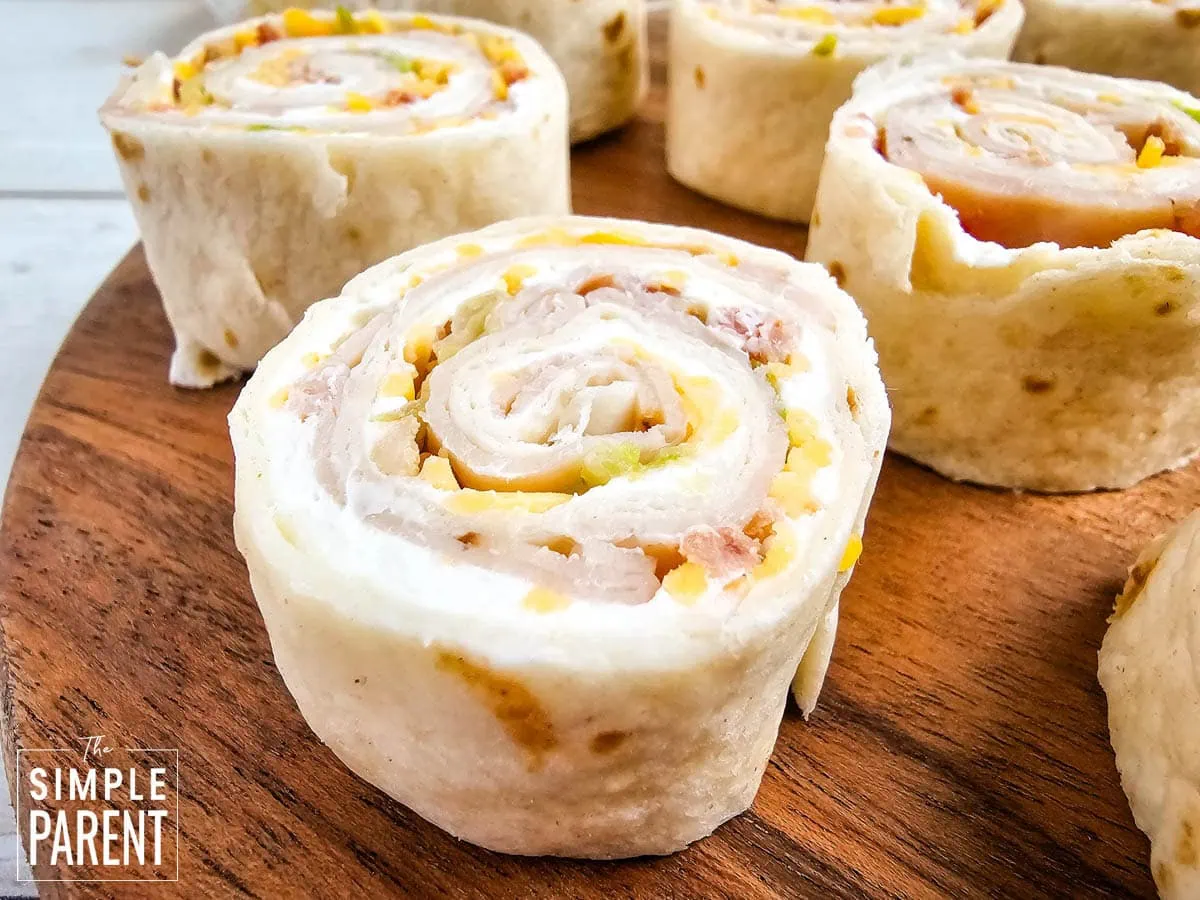 Turkey Roll Up on wooden cutting board