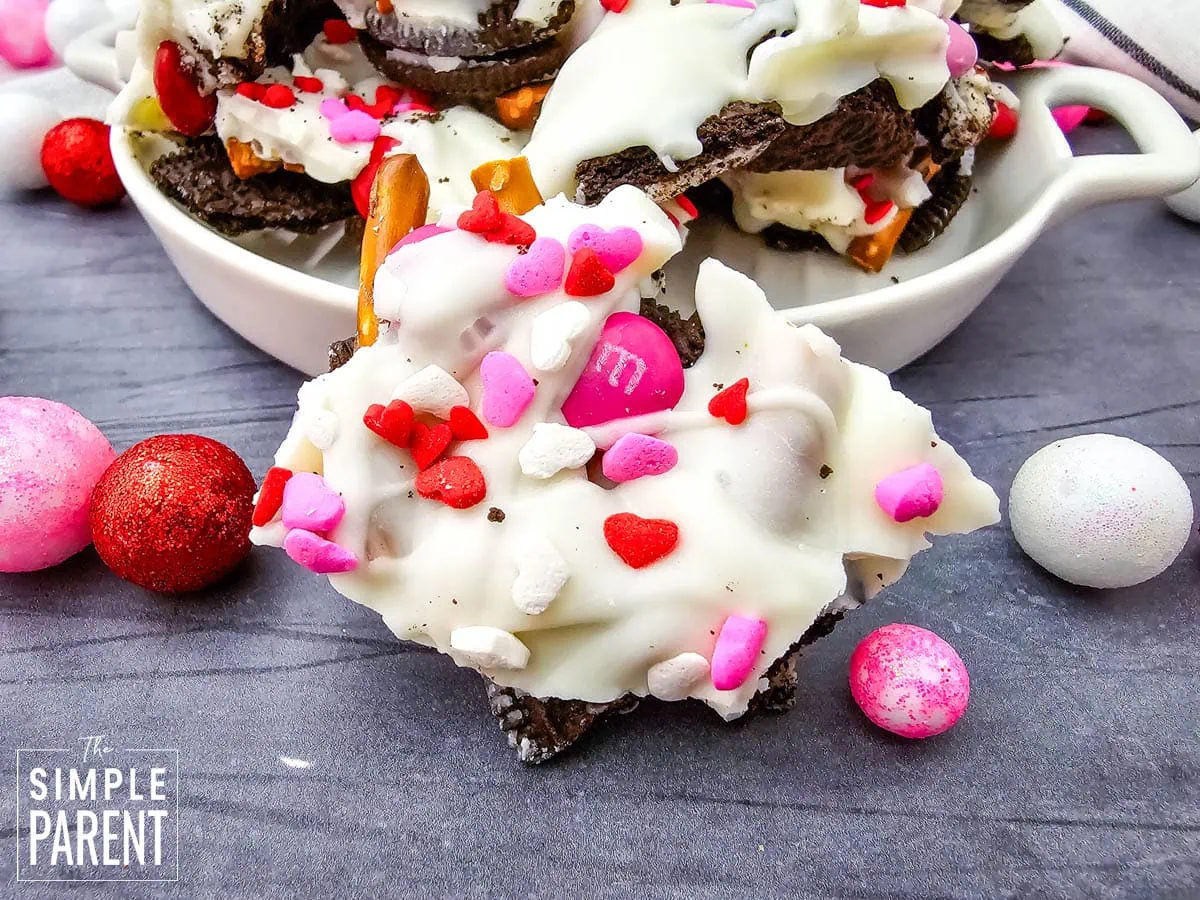 Piece of Valentines chocolate bark on dark counter