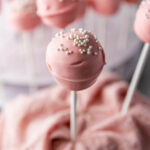 Pink Valentine's Day cake pop with white sprinkles