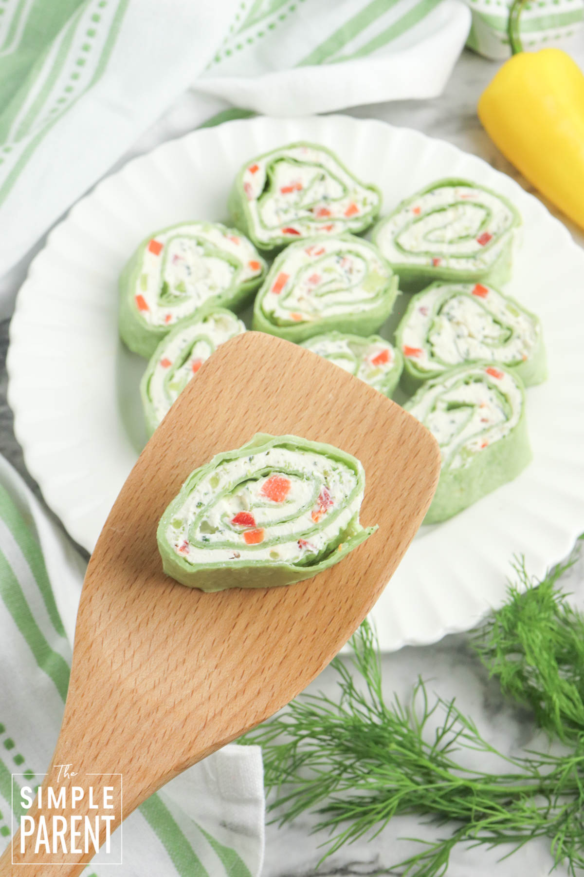 Vegetable pinwheel on wooden spoon