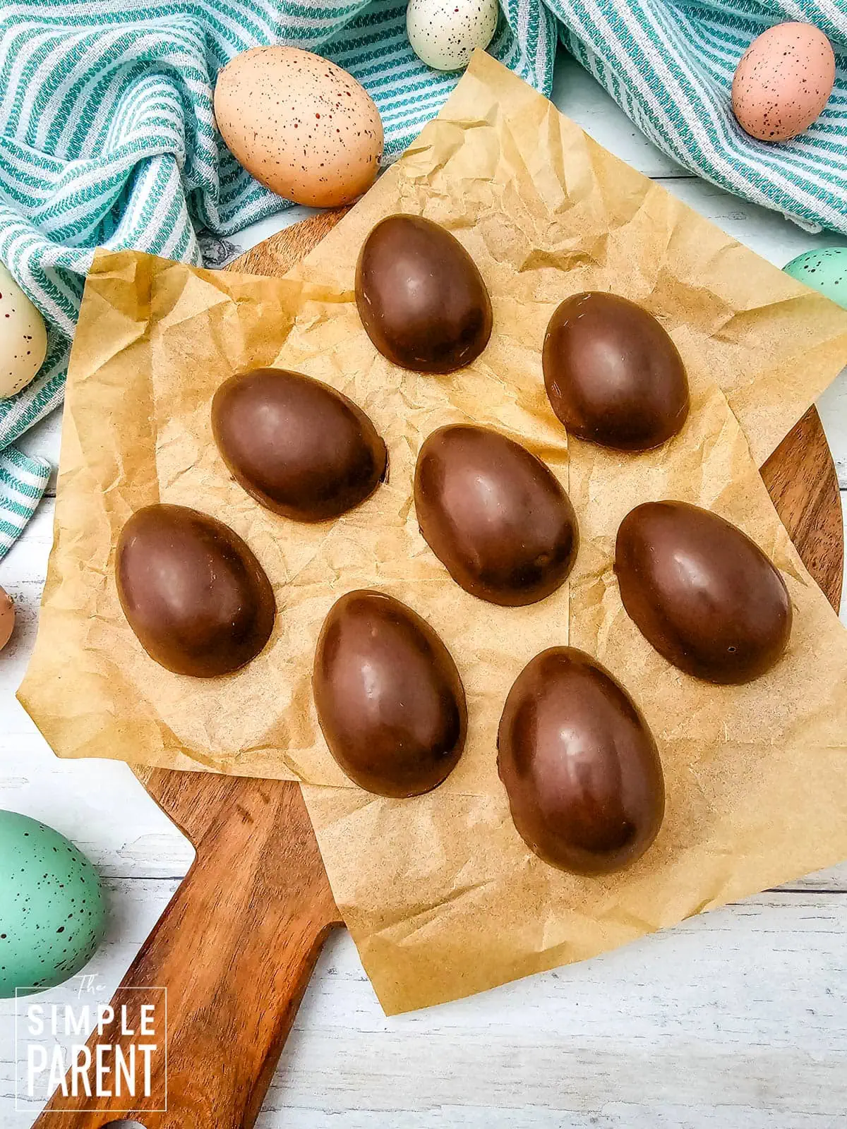 Homemade Peanut Butter Eggs on wooden serving board