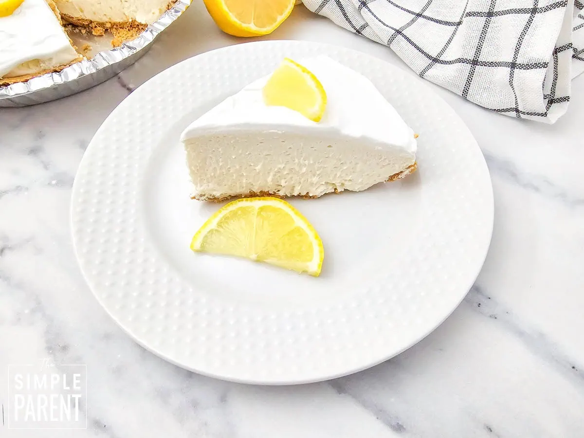 Slice of No Bake Lemon Cream Cheese Pie on white plate