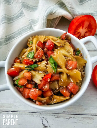 Bruschetta pasta salad in white bowl