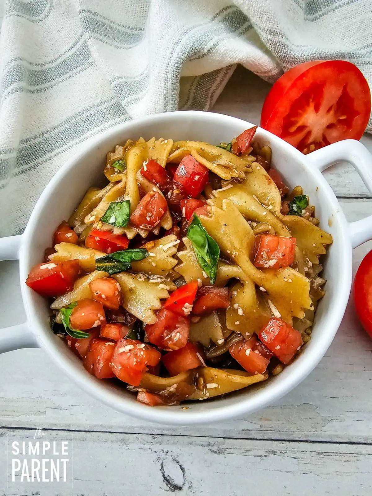 Bruschetta pasta salad in white bowl