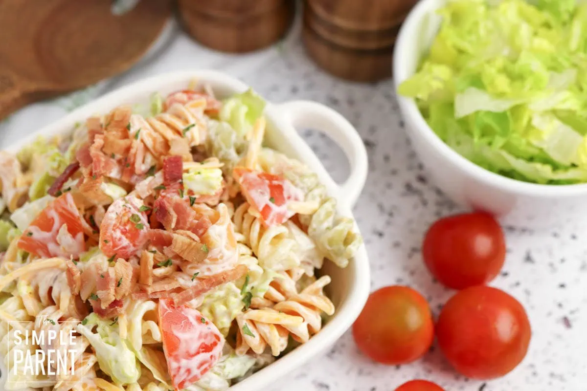 bacon lettuce tomato pasta salad in white serving bowl