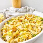 Caesar pasta salad in white serving bowl