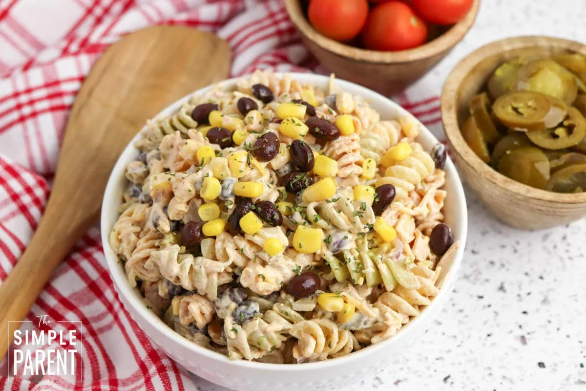 mexican corn pasta salad in white serving bowl