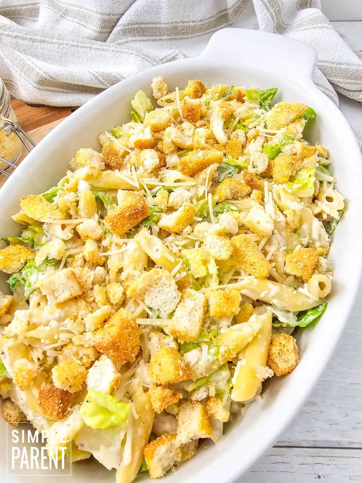 pasta caesar salad in white bowl