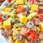 sausage pasta salad in white bowl