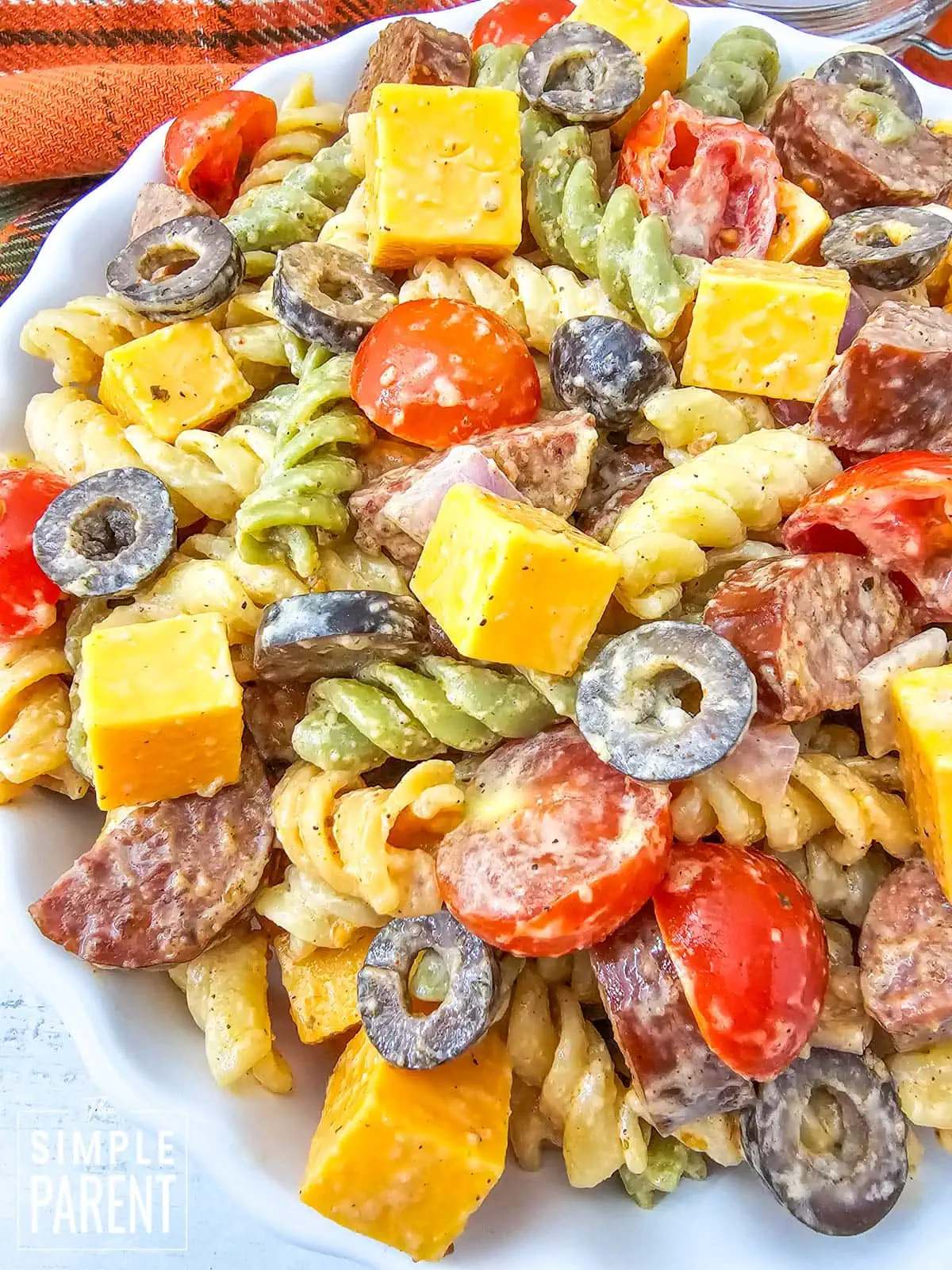 sausage pasta salad in white bowl
