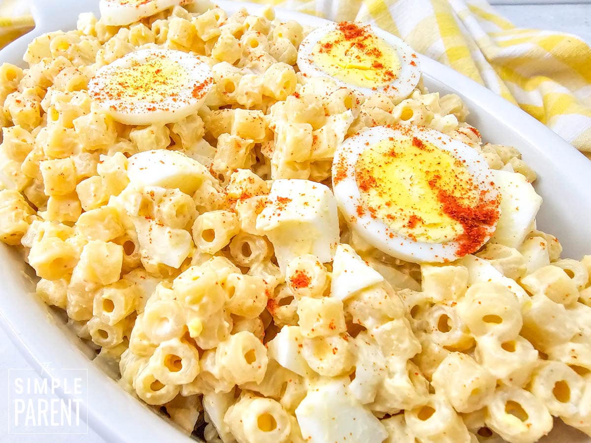 Creamy Deviled Egg Macaroni Salad in white serving dish
