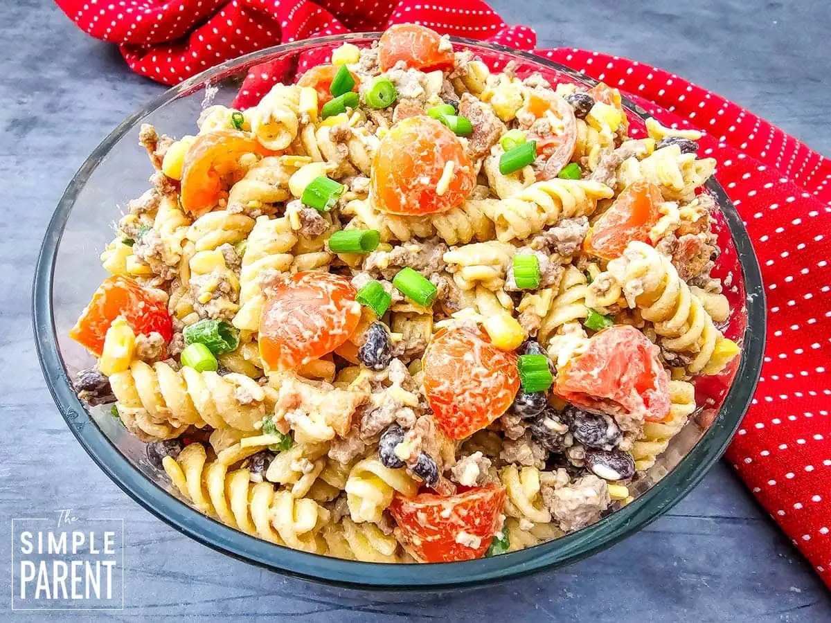 Cowboy caviar pasta salad in glass serving bowl