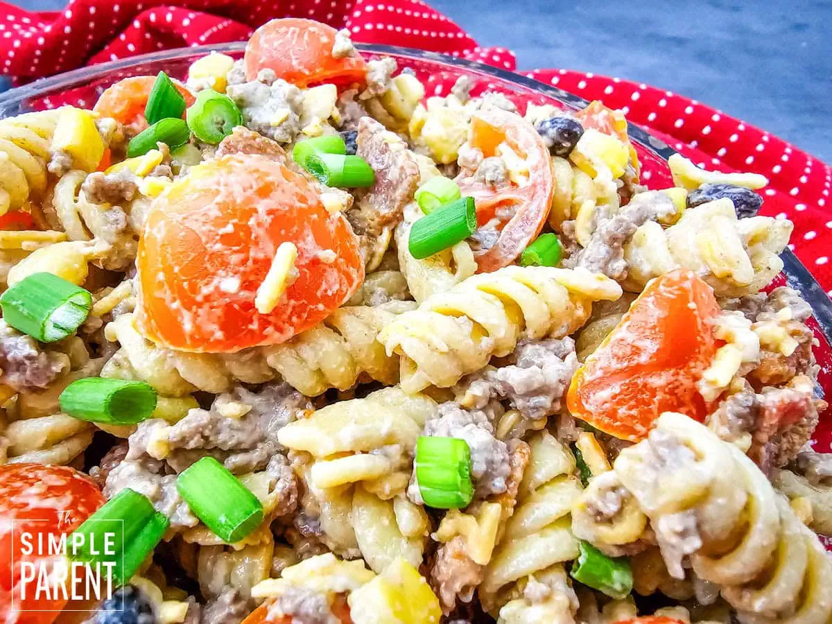 Cowboy Pastas with tomatoes and rotini in glass serving bowl