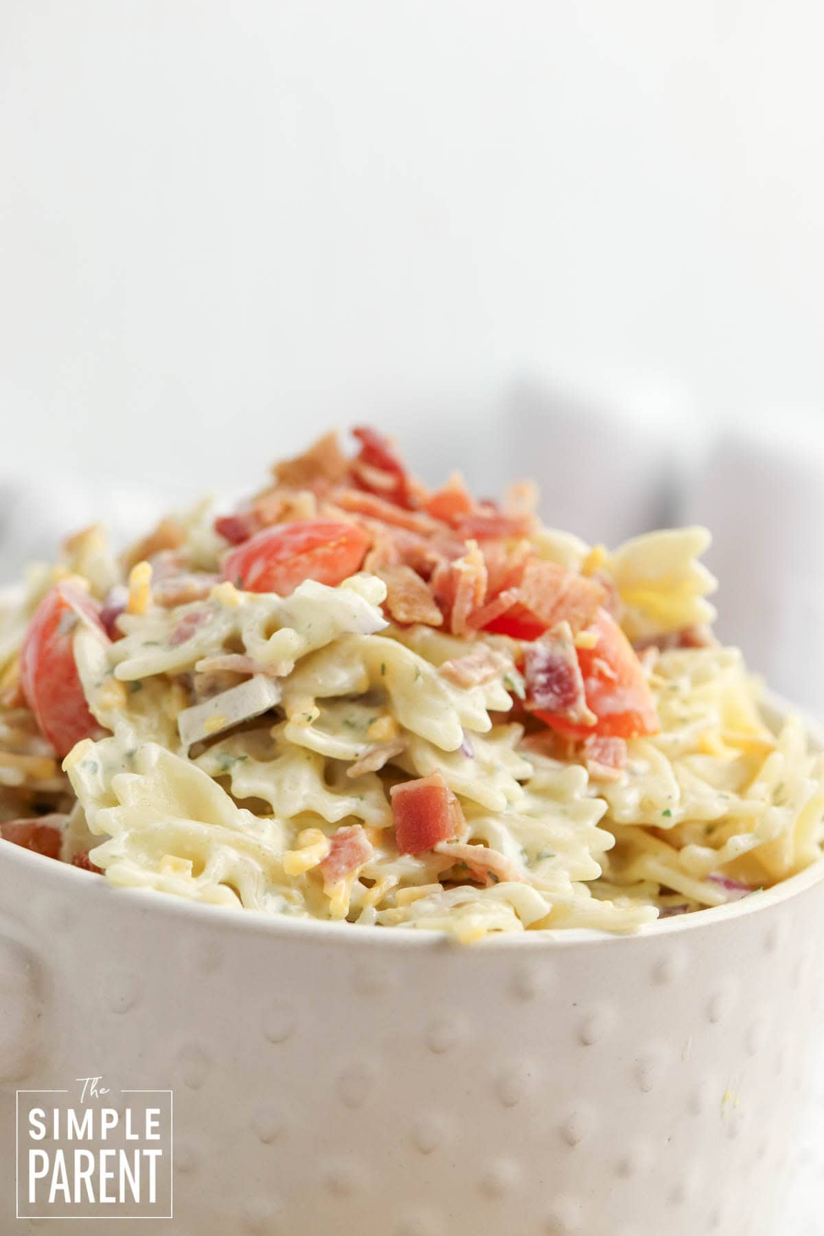 creamy bacon ranch pasta salad in white bowl