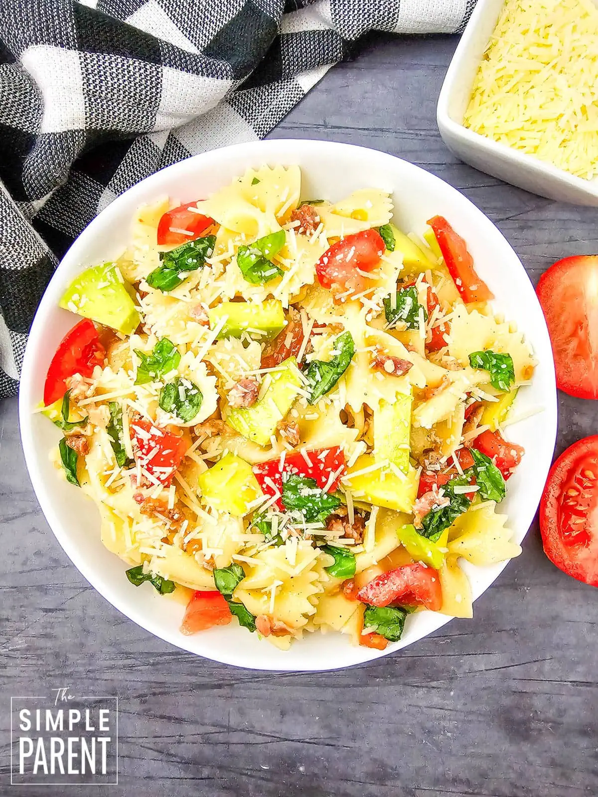 bacon tomato avocado pasta salad on white plate