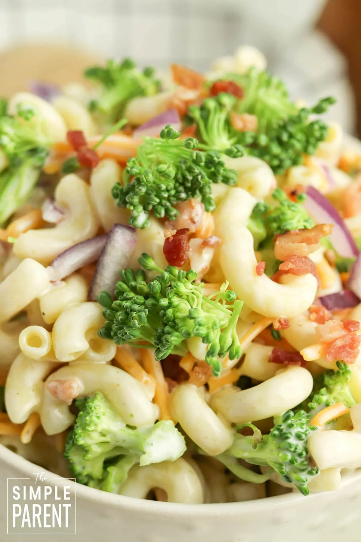 Broccoli pasta salad with bacon for potlucks and parties in white serving bowl