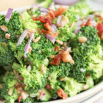 Easy Old Fashioned Broccoli Salad for Thanksgiving and Potlucks in white serving bowl