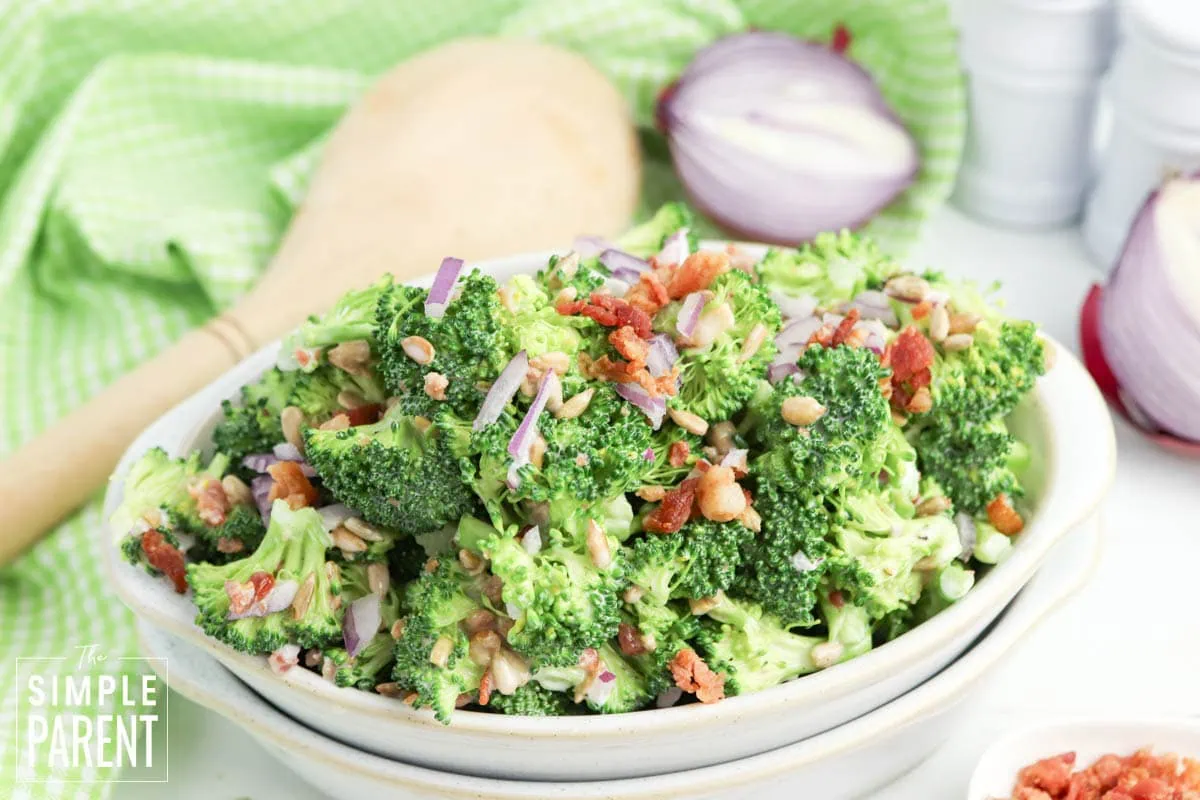 broccoli salad with bacon in white serving bowl
