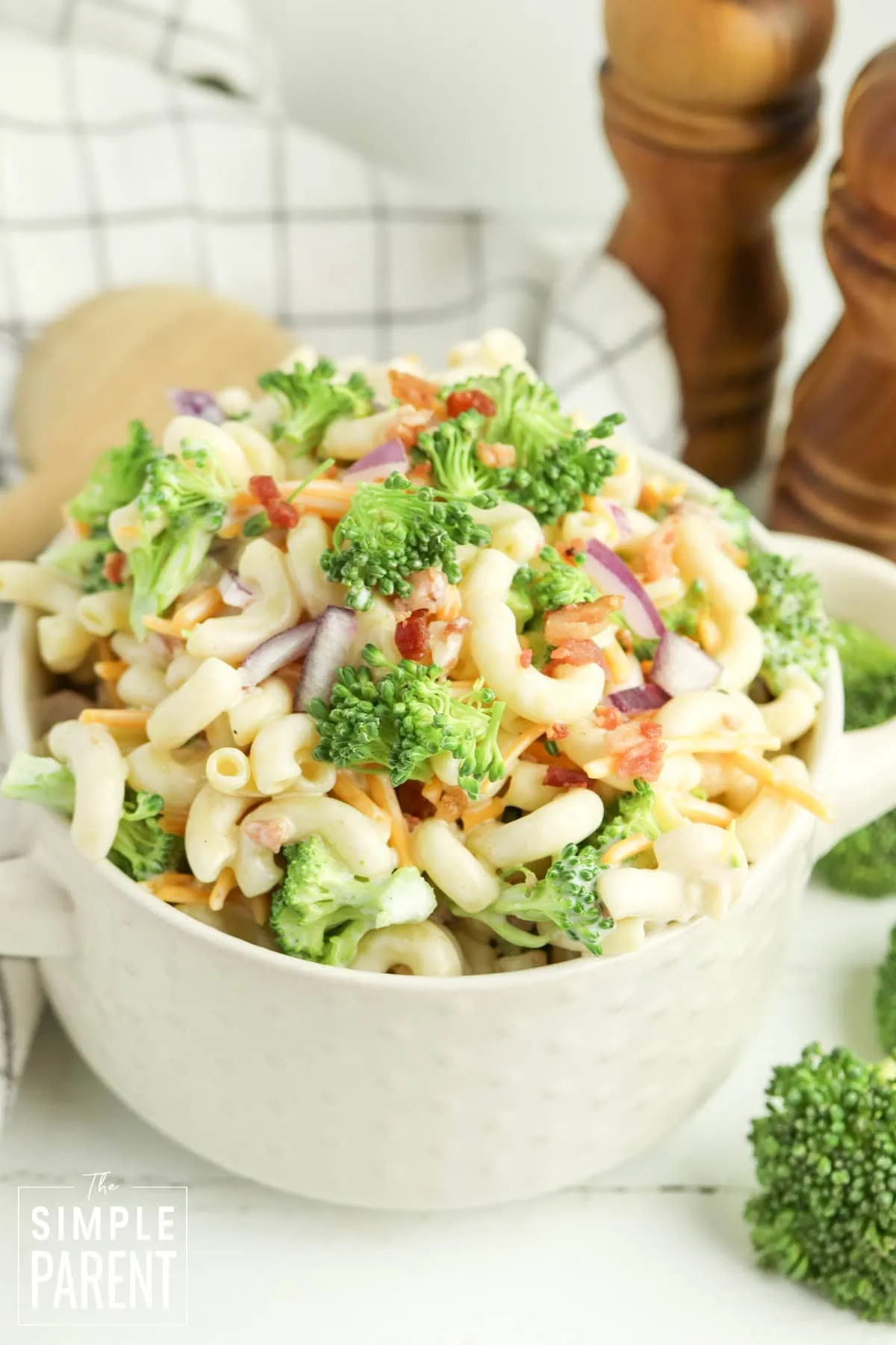 Creamy broccoli cheddar pasta salad in white bowl