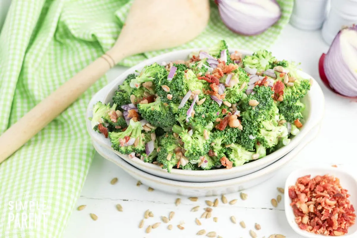 crunchy broccoli salad in white bowl