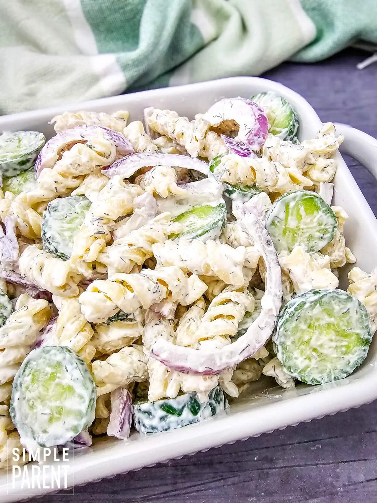 cucumber and pasta salad in white dish