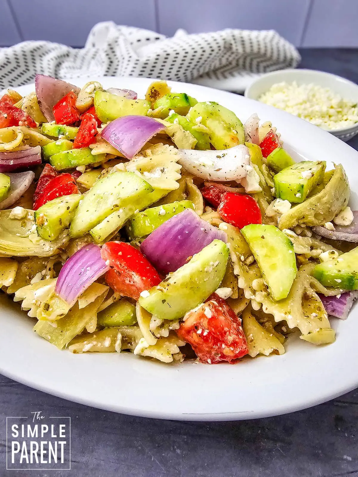 Greek pasta salad with feta in white serving bowl