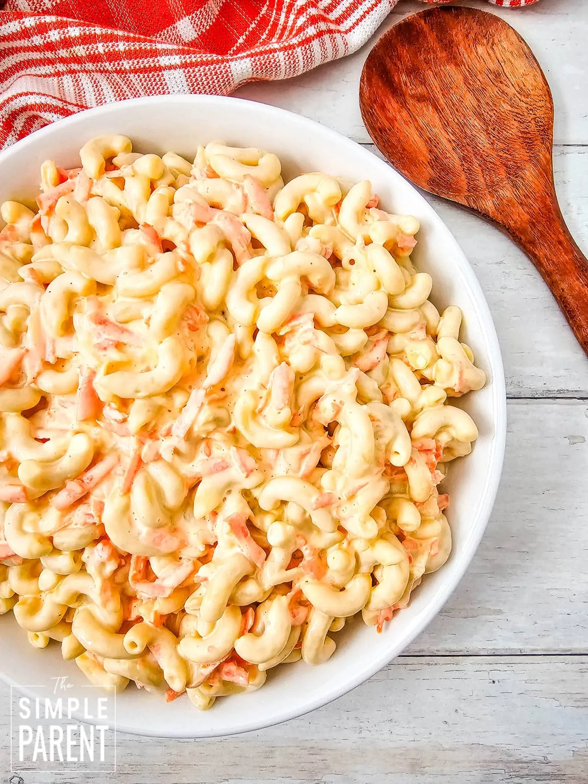 mac salad recipe with carrots on white serving plate