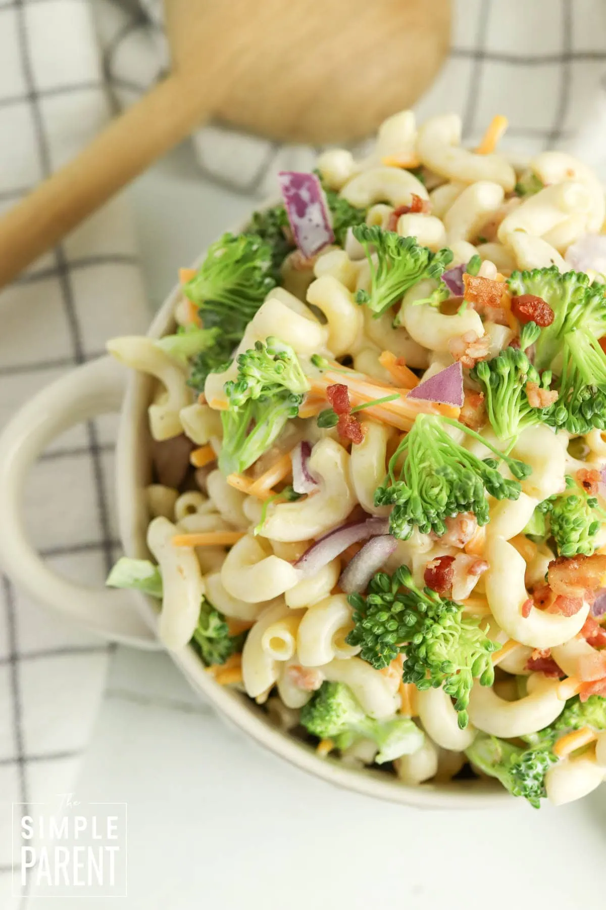 pasta broccoli salad in white bowl