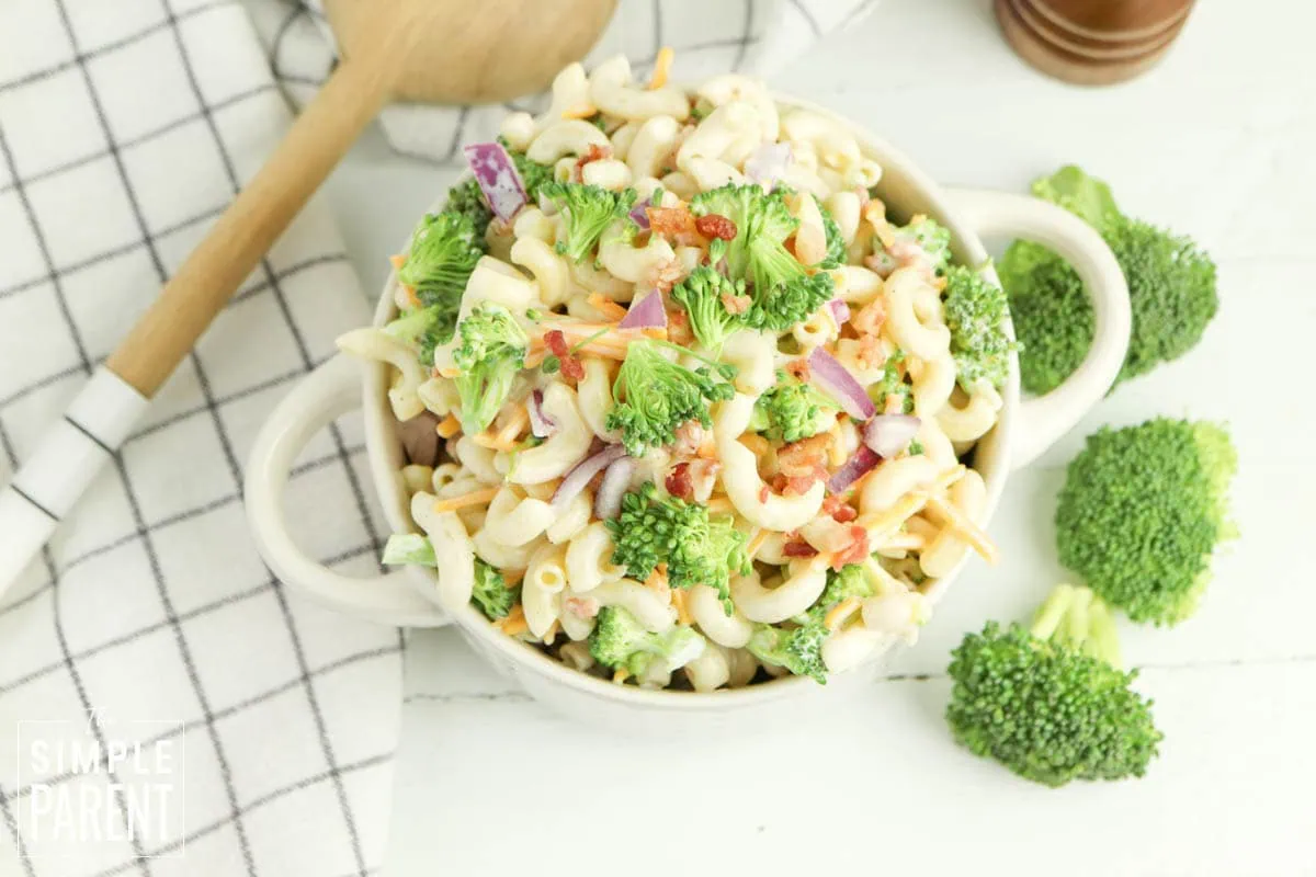 pasta salad with broccoli in white serving bowl