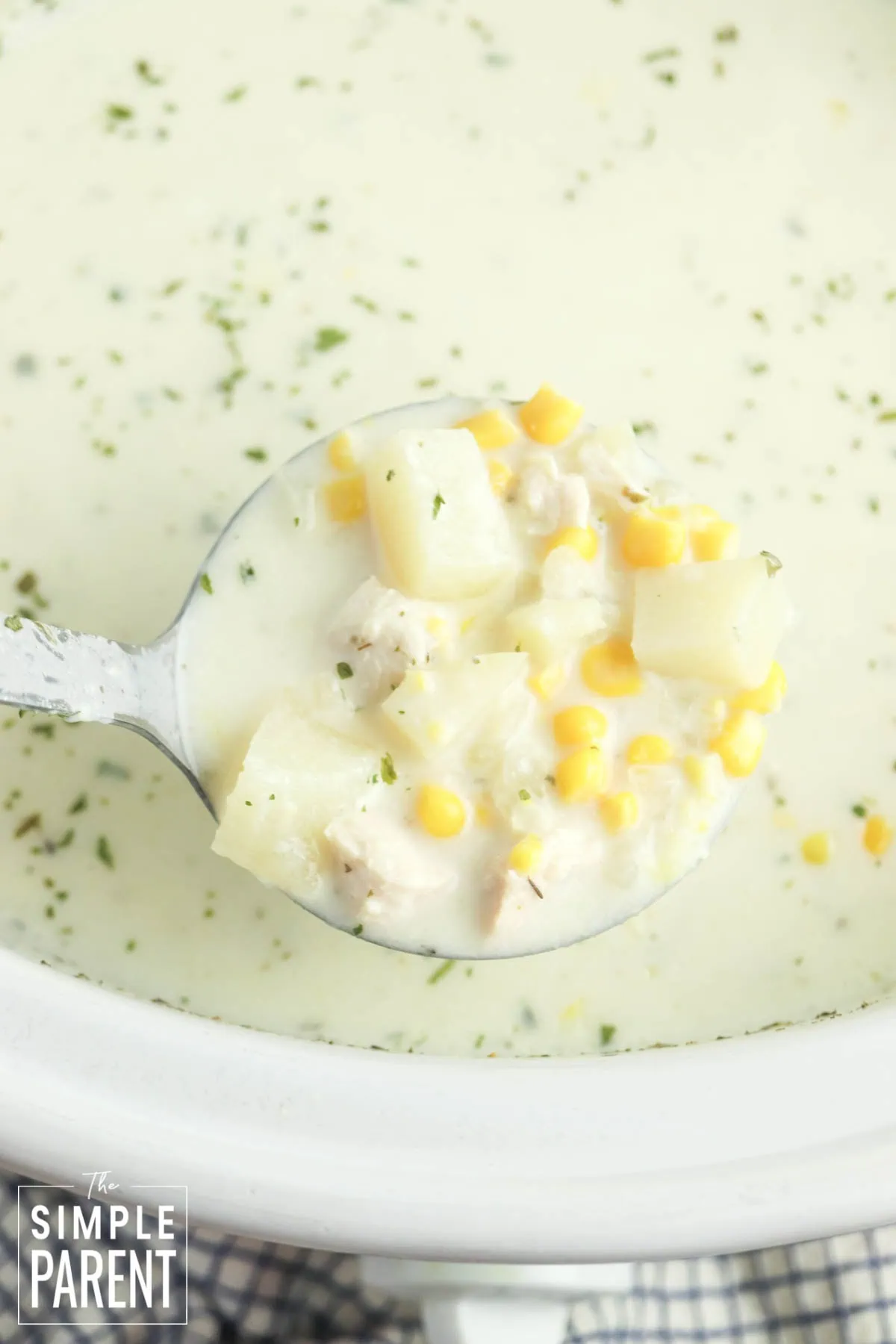 Ladle of Creamy Chicken Corn Chowder in Crockpot