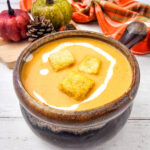 Easy Creamy Pumpkin Soup in dark brown soup bowl